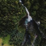 A bird's eye view of a waterfall in a forest