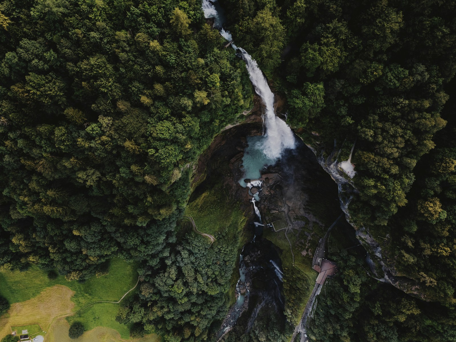 A bird's eye view of a waterfall in a forest