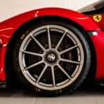 A red sports car parked in a garage